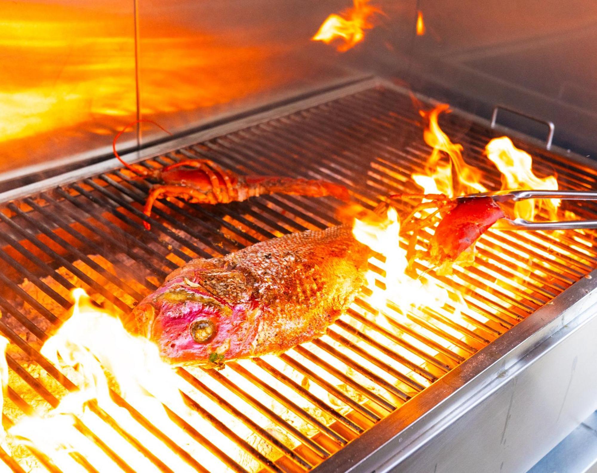 Voco Monaco Dubai By Ihg, Adults Only, World Islands Hotel Exterior photo A steak being grilled